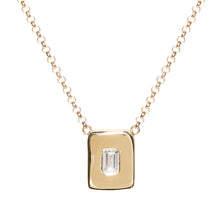 Load image into Gallery viewer, Look no further for the perfect every day necklace. This necklace is wonderful worn on its own or layered with others. An emerald cut diamond is nestled among a hand sculpted gold chunk. The pendant is centered on a rolo chain which can be worn at 16" and 18". 14k yellow gold Lobster clasp closure Handcrafted in NYC