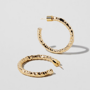 Make a statement with the 1" Hailey Mini Hoops, perfect for levelling up your style game. Featuring a hand textured design and lightweight feel, these earrings will keep you on-trend for any occasion. Features solid 14K gold posts for long-lasting wear.&nbsp;