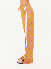 Load image into Gallery viewer, Yellow floral pants with a white background
