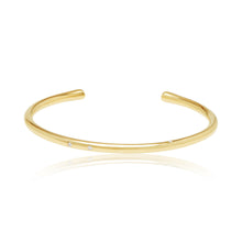 Load image into Gallery viewer, The cuff features an open design, allowing it to be easily slipped onto the wrist and adjusted for a comfortable fit. The absence of a clasp or closure adds to its sleek and modern appeal. The smooth, polished surface of the cuff reflects light beautifully, creating a captivating and radiant glow.  14K Yellow Gold Diamonds
