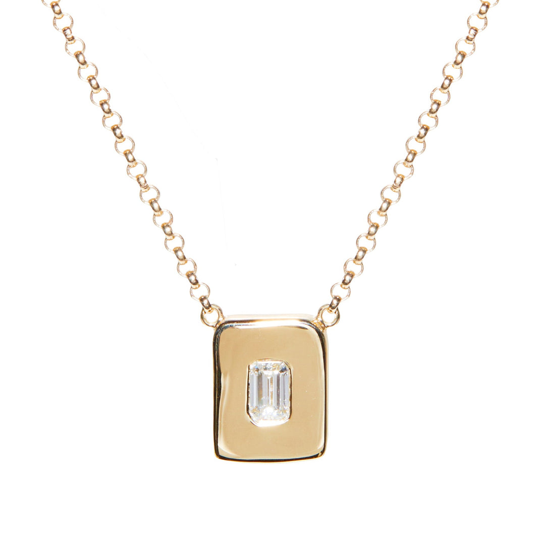 Look no further for the perfect every day necklace. This necklace is wonderful worn on its own or layered with others. An emerald cut diamond is nestled among a hand sculpted gold chunk.   The pendant is centered on a rolo chain which can be worn at 16