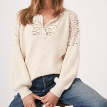 Load image into Gallery viewer, This sweater is crafted from medium-weight, textured knit in pure cotton. It features a round neckline with a slit, long raglan puff sleeves with ribbed cuffs, and a ribbed hem. Designed in a straight knitted style with a casual fit, it showcases crochet finishing at the armholes and shoulders. Care instructions advise hand washing, with dry cleaning also possible, and it&#39;s made entirely of 100% cotton.
