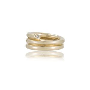 A unique and contemporary piece that transcends traditional design boundaries, offering a striking balance between elegance and artistic innovation. Crafted with meticulous attention to detail, this ring boasts a mesmerizing coil-like structure that wraps around your finger with graceful fluidity. With Diamonds on each side.   14K Yellow Gold Handcrafted in NYC 
