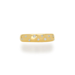 This ring is a true embodiment of contemporary elegance, offering a unique and enchanting piece that effortlessly captures attention. Scattered amidst the intricate bubbles are dazzling diamonds that add an unexpected and mesmerizing touch.  Whether worn alone as a statement piece or stacked with other rings to create a unique look, this 14k gold bubble ring with scattered diamonds is a versatile addition to your jewelry collection.  14K Yellow Gold  Diamonds